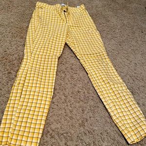 a size med plaid with yellow pants that have a stretchy material leggings style